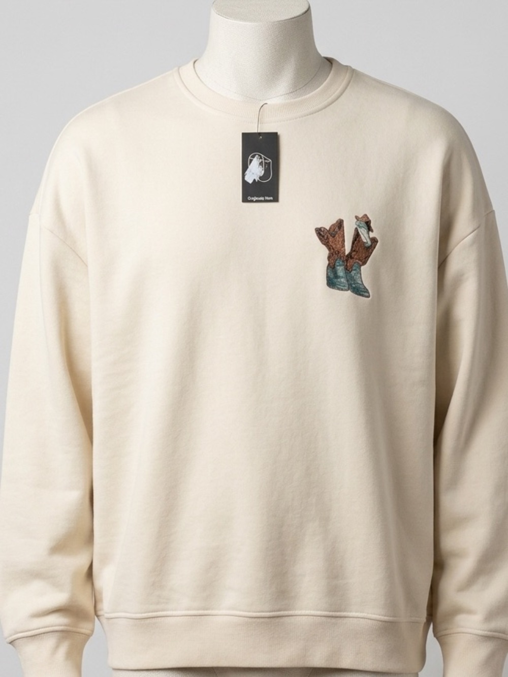 Original Use Cream Crewneck Sweatshirt with Embroidered Boot Motif